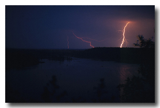 Lightning strike reflected in the AuSable River - Scan from a slide
